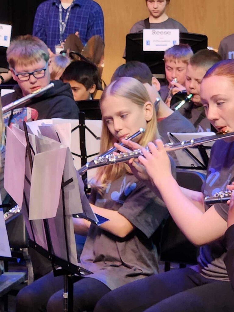 students playing their instruments during a band rehearsal