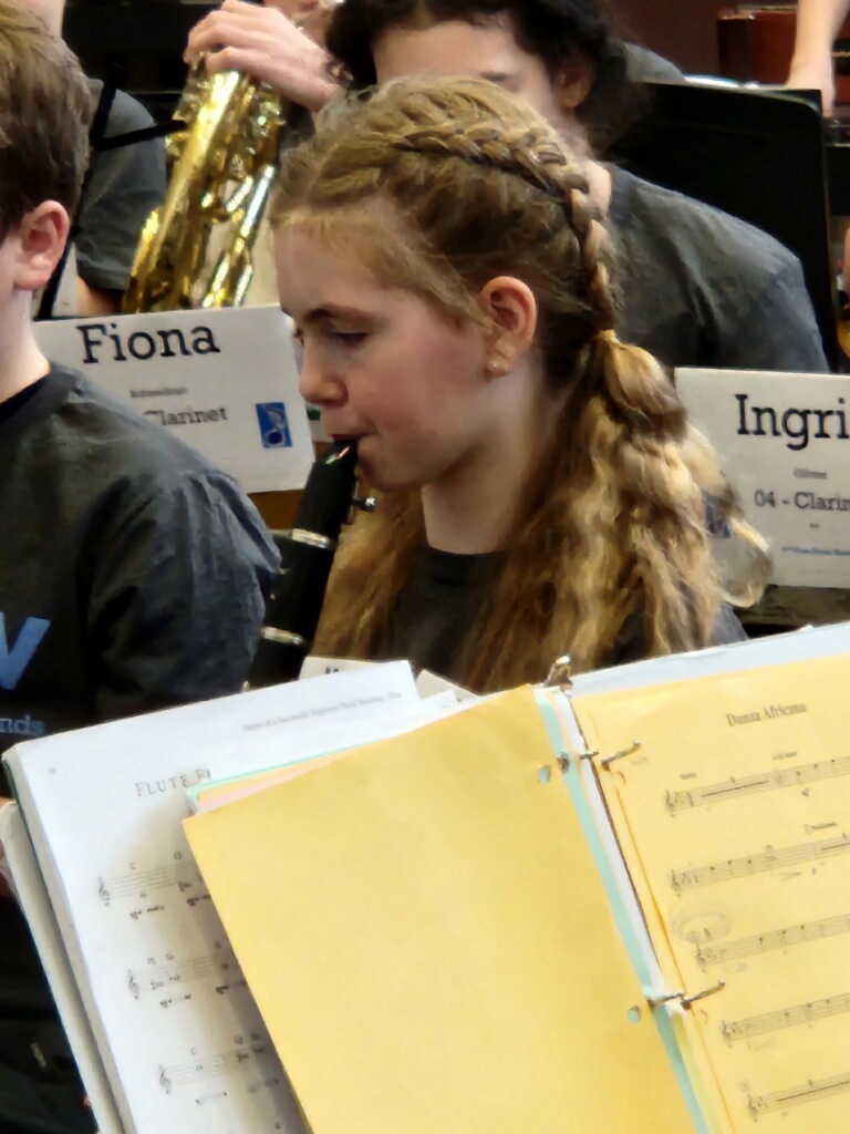 students playing their instruments during a band rehearsal
