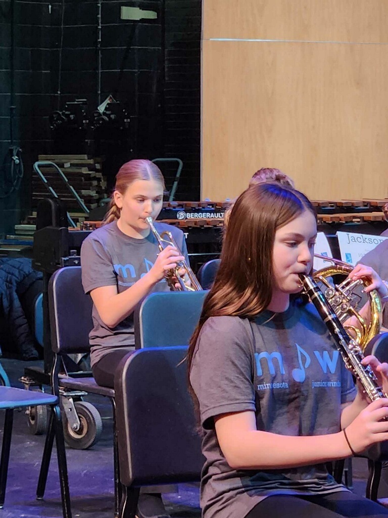 students playing their instruments during a band rehearsal