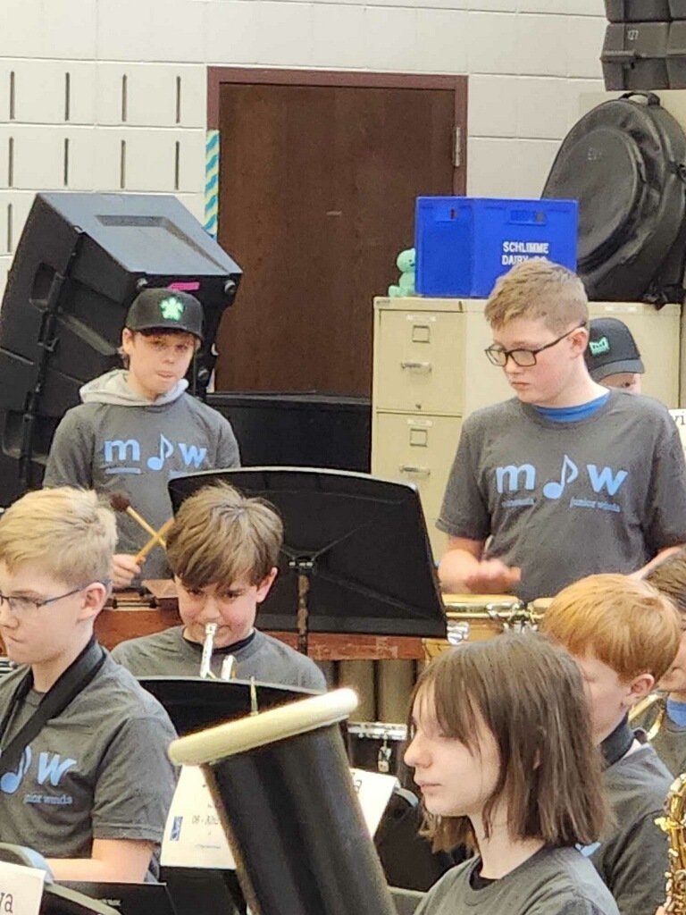 students playing their instruments during a band rehearsal