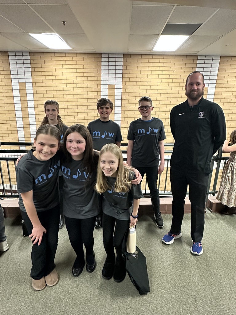 group photo of 5th and 6th grade students who participated in an honor band with their director