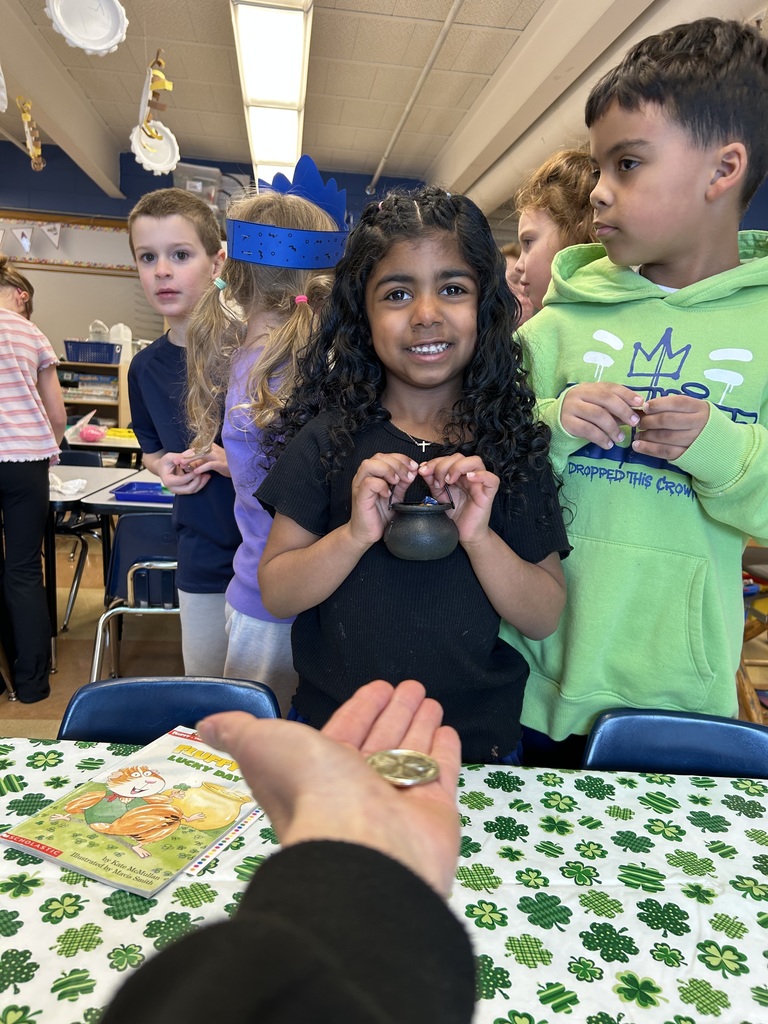 a student trading in a gold coin for a whole pot full of gold candies