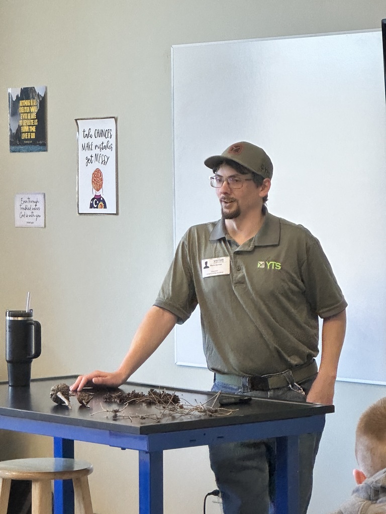 arborist speaking in the front of a classroom