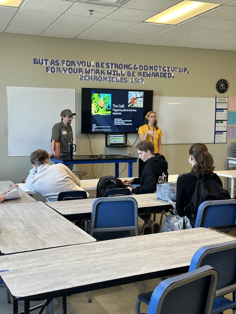 arborist speaking in the front of a classroom