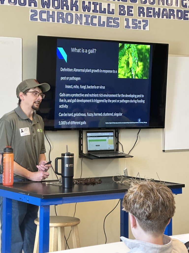 arborist speaking in the front of a classroom