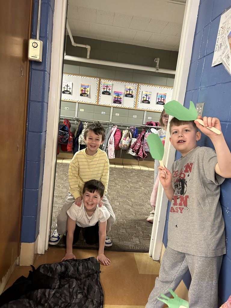 1st grade students reenacting palm sunday