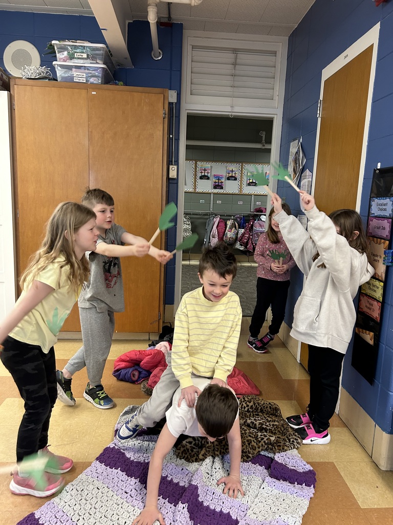 1st grade students reenacting palm sunday