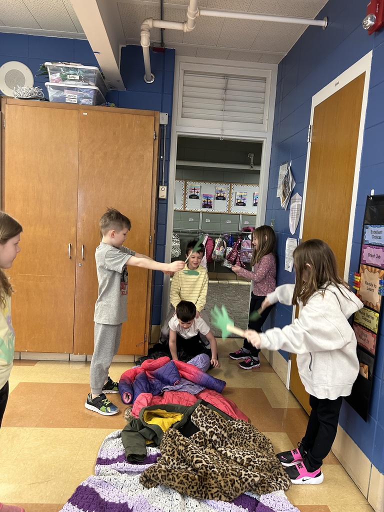 1st grade students reenacting palm sunday