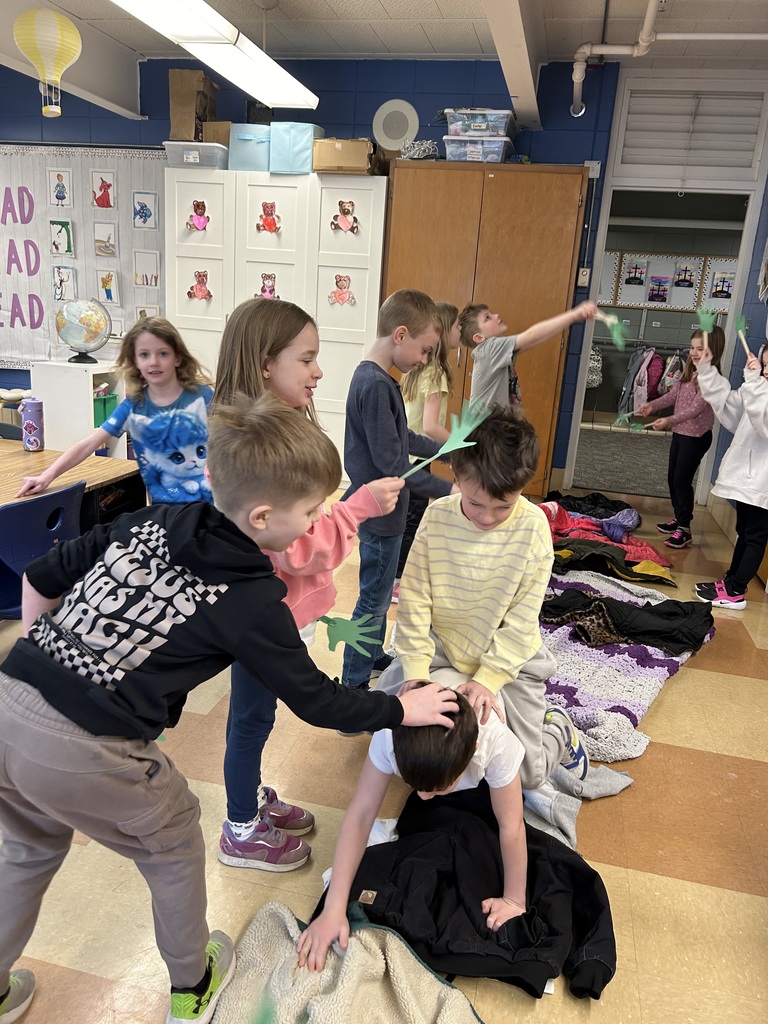 1st grade students reenacting palm sunday