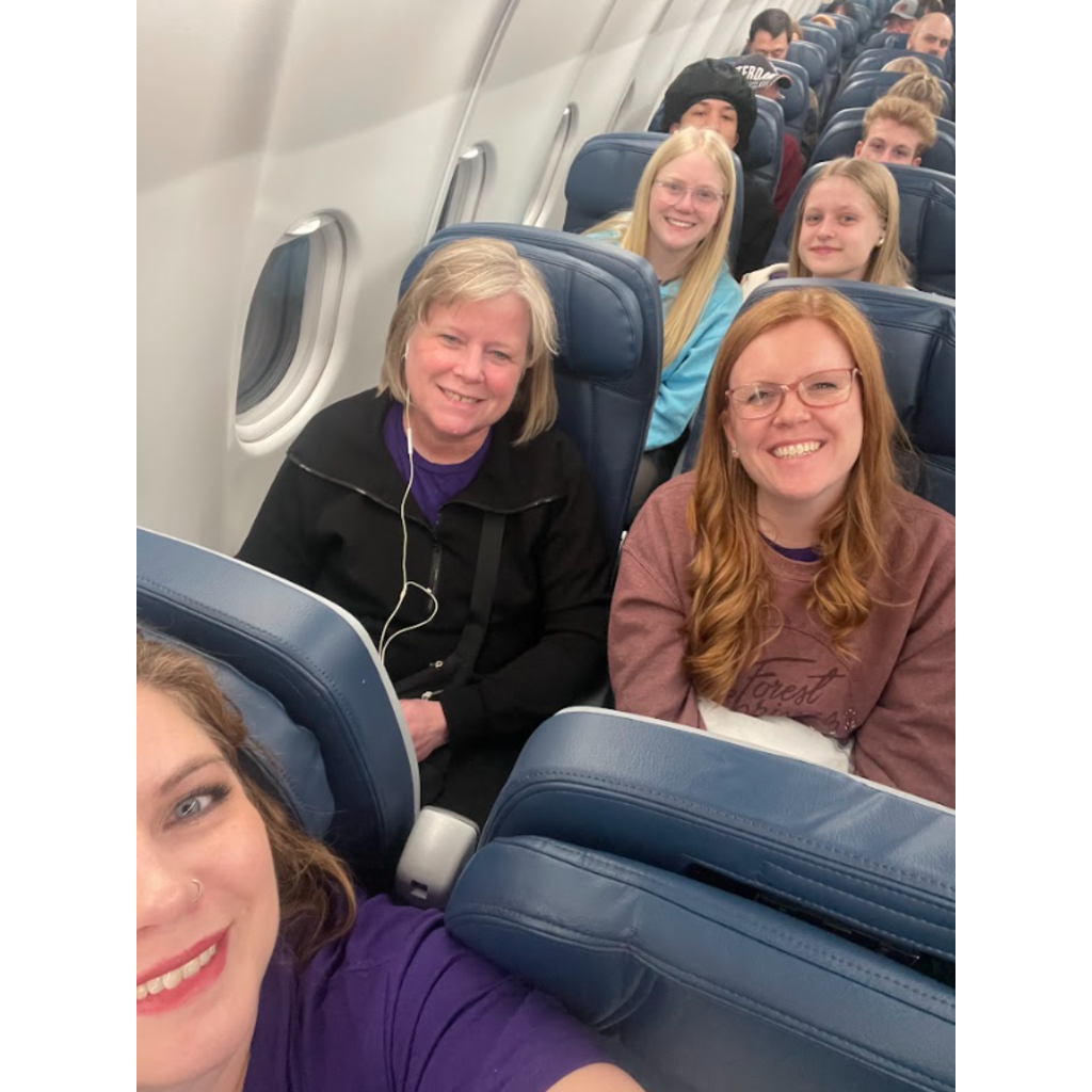 teachers and students on an airplane