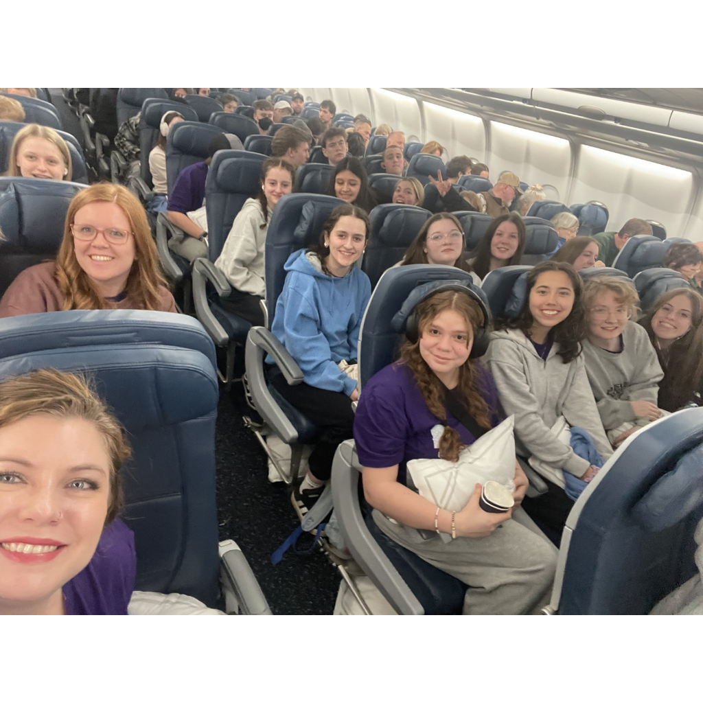teachers and students on an airplane
