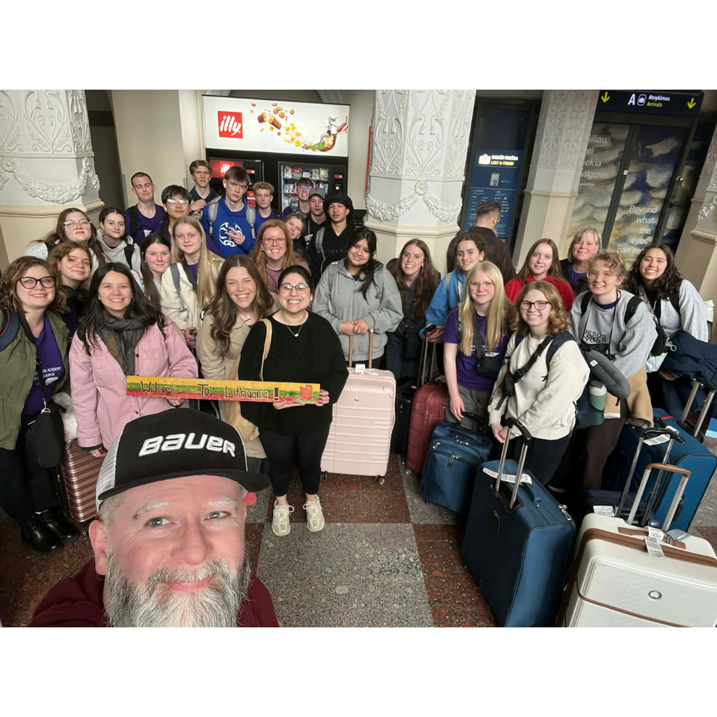 group photo of high school students on a mission trip with their hosts