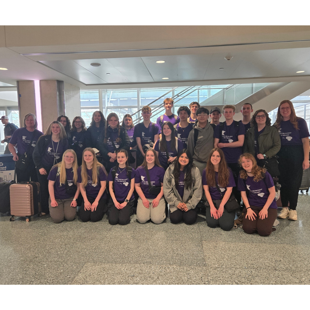 group photo of high school students in the airport