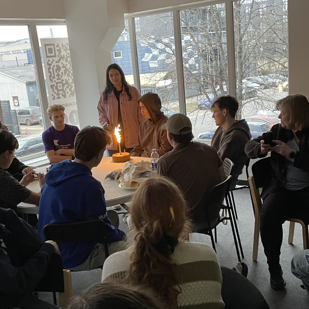 student being given a birthday dessert