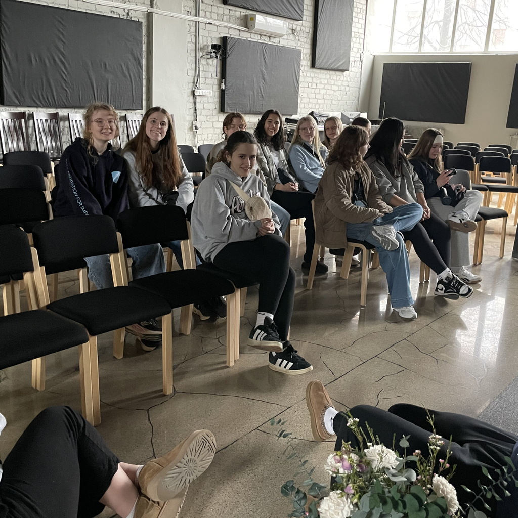 group of students sitting in chairs