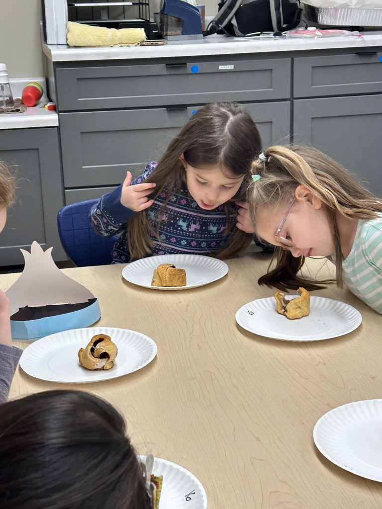 pre-k students looking inside their rolls