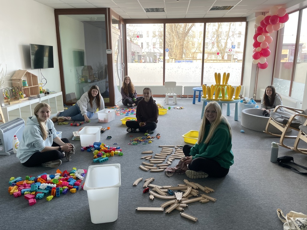 students organizing toys