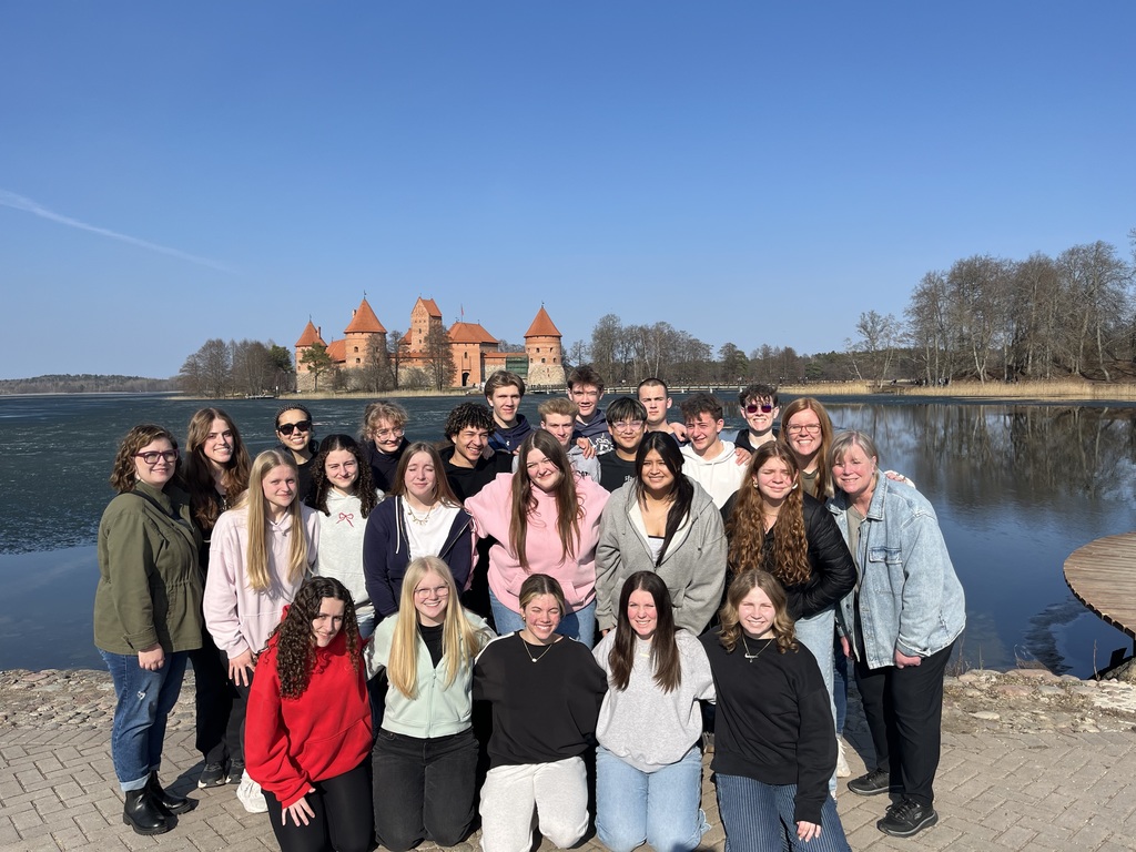 group photo of students in front of a castle