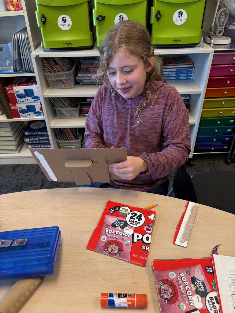 student working on an art project