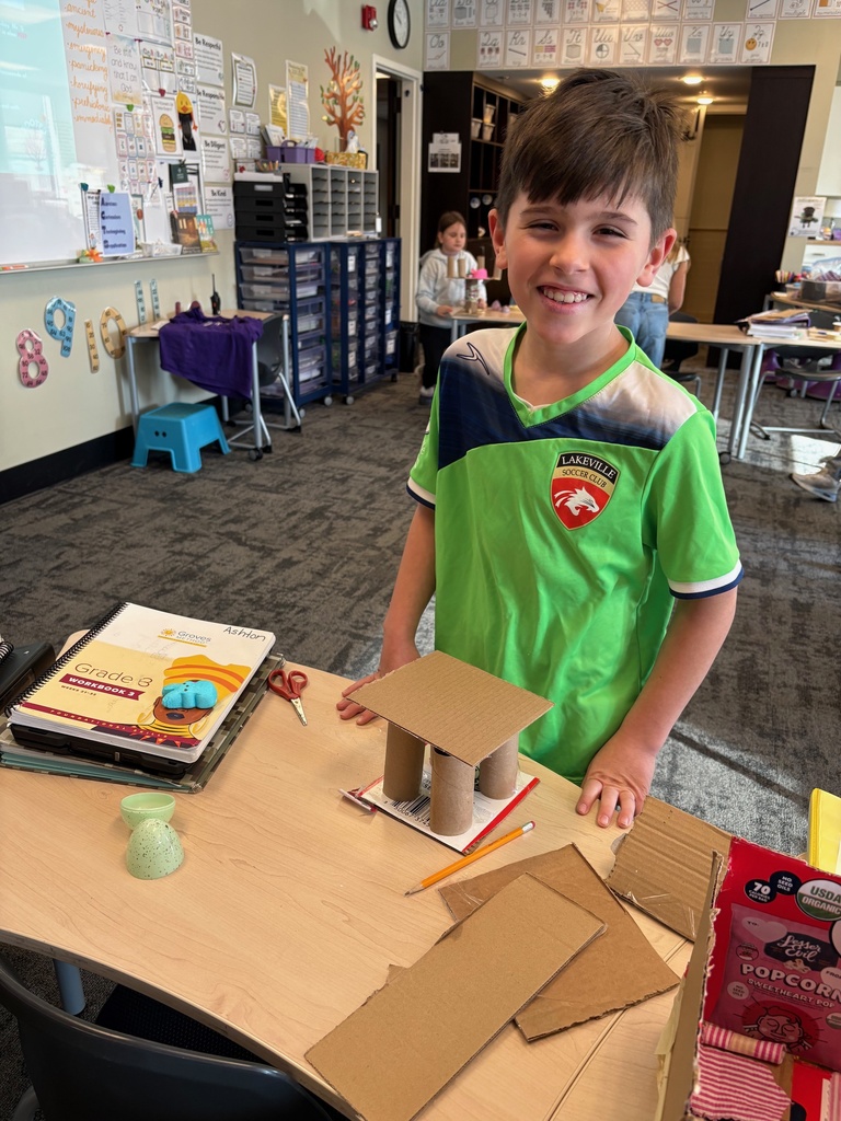 student working on an art project