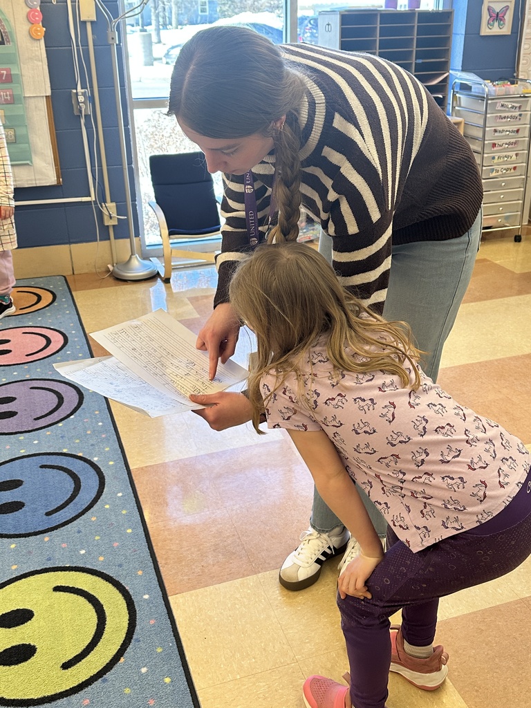 student getting help from a teacher