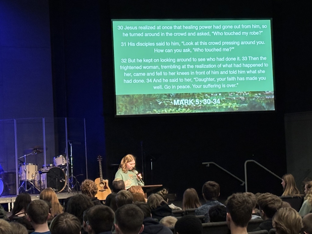 high school students speaking in a chapel service
