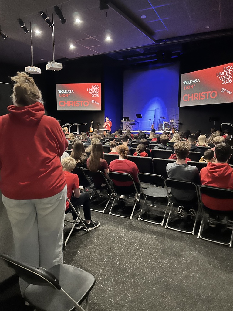 secondary students sitting in a chapel service