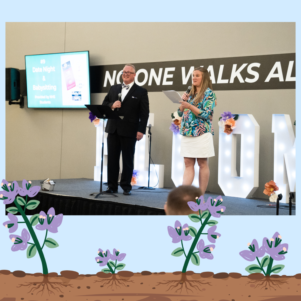 auctioneer and emcee speaking on stage