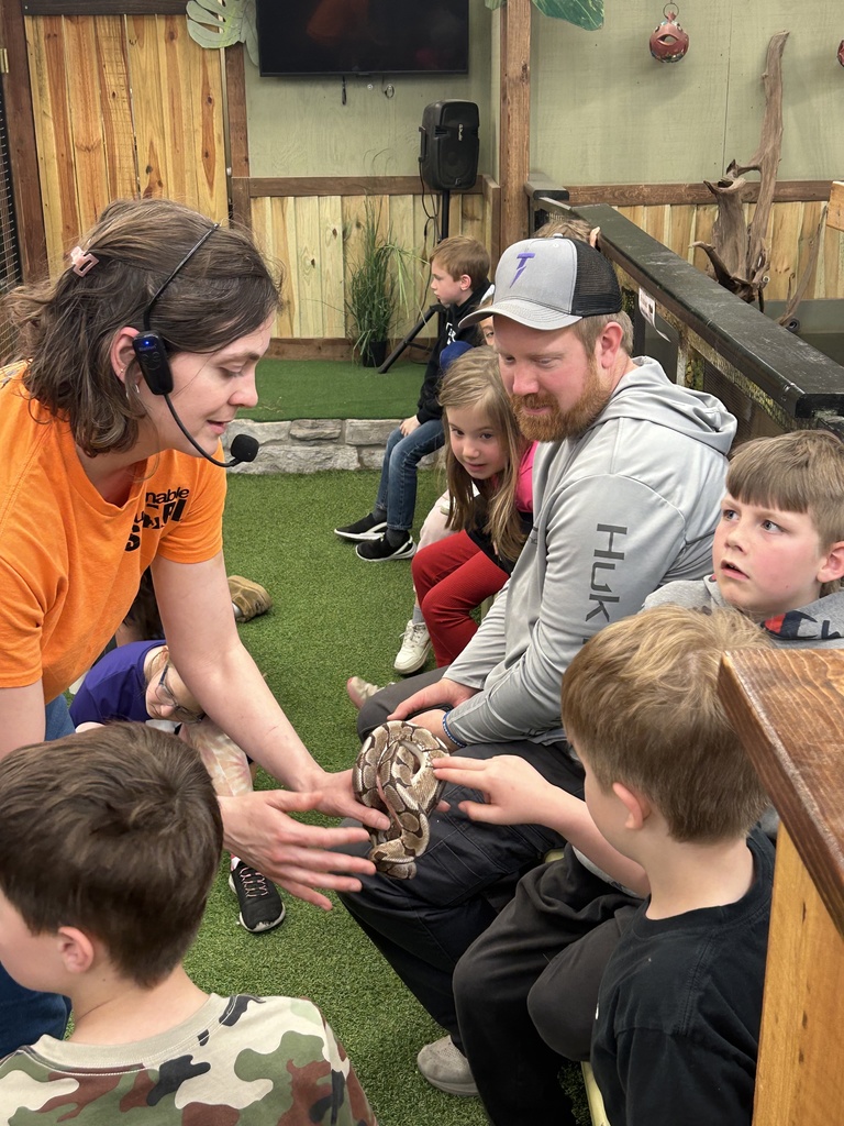students petting a snake