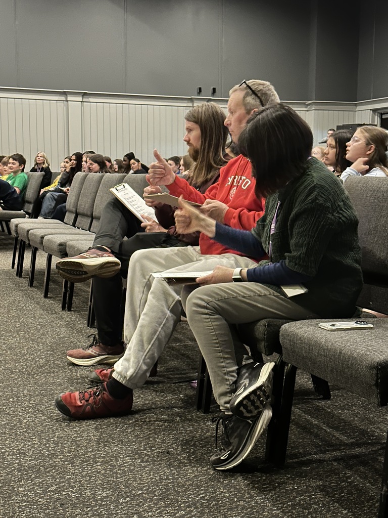 judges giving a thumbs up during a spelling bee