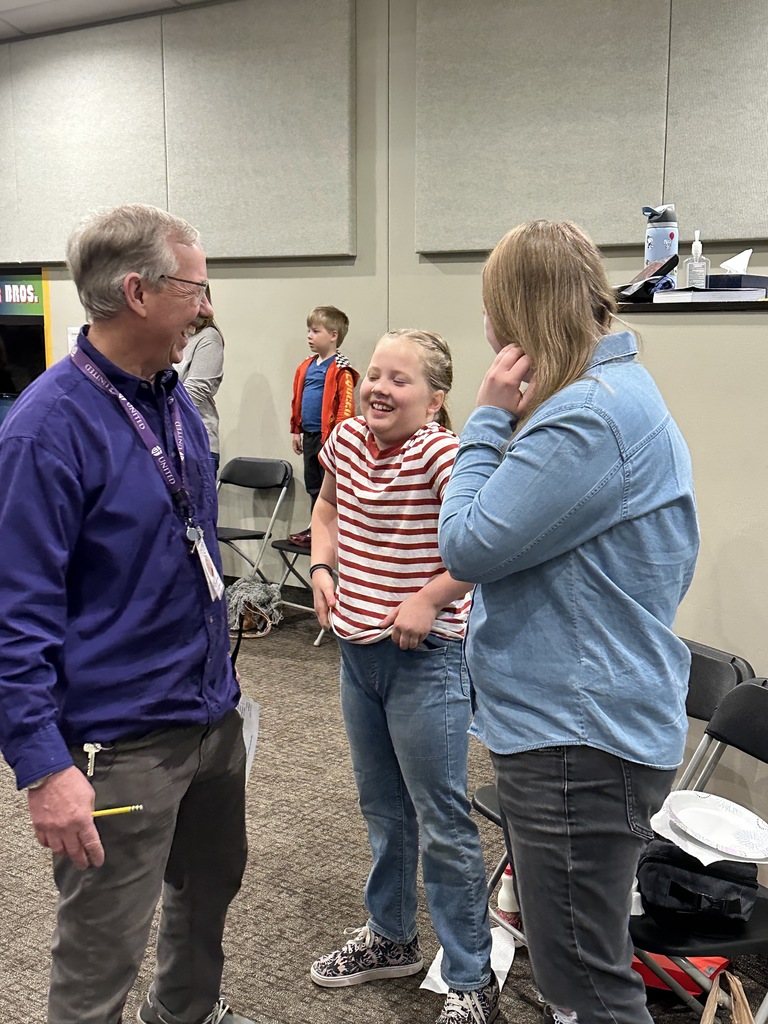student, pastor and principal talking