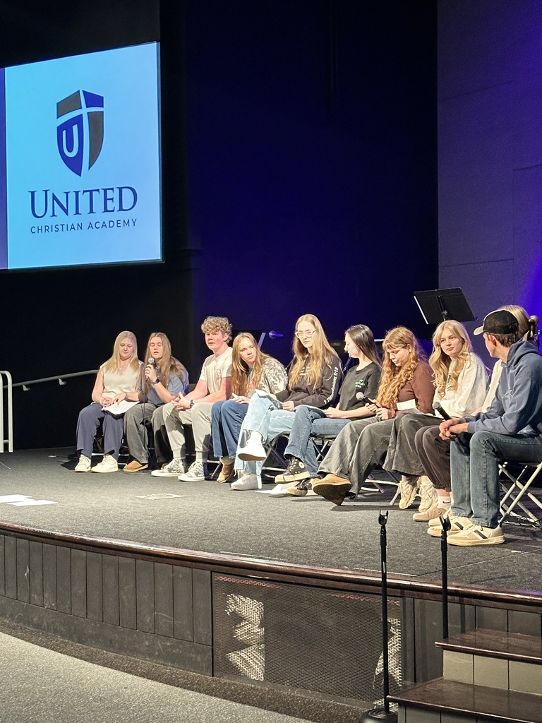 panel of high school students on a stage