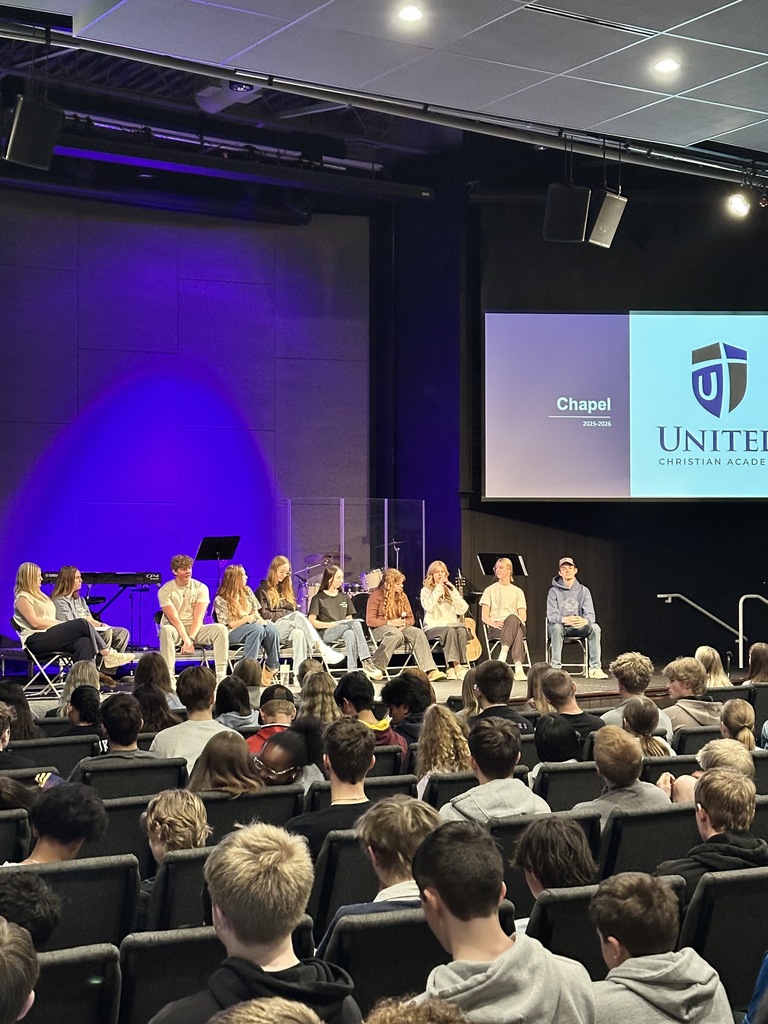 panel of high school students on a stage