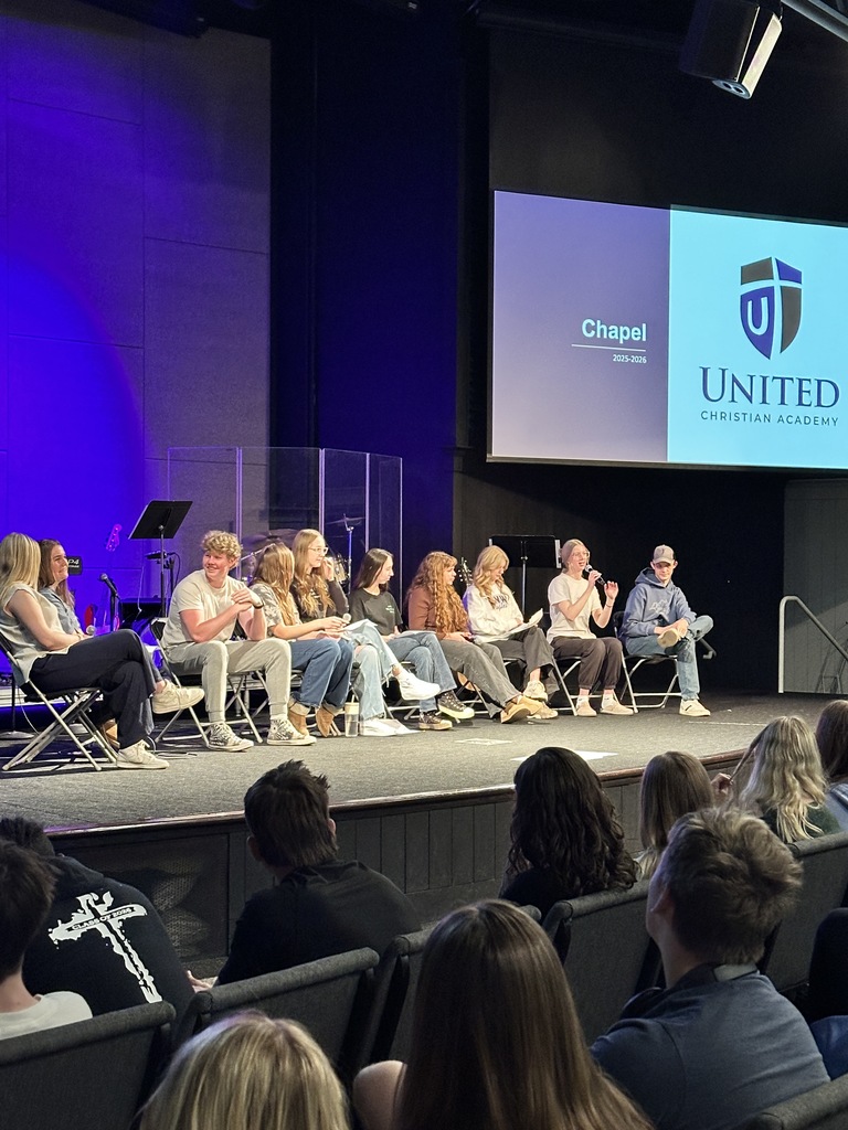 panel of high school students on a stage