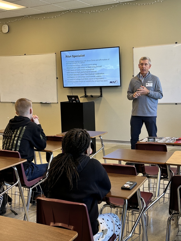 guest speaker in the front of a classroom