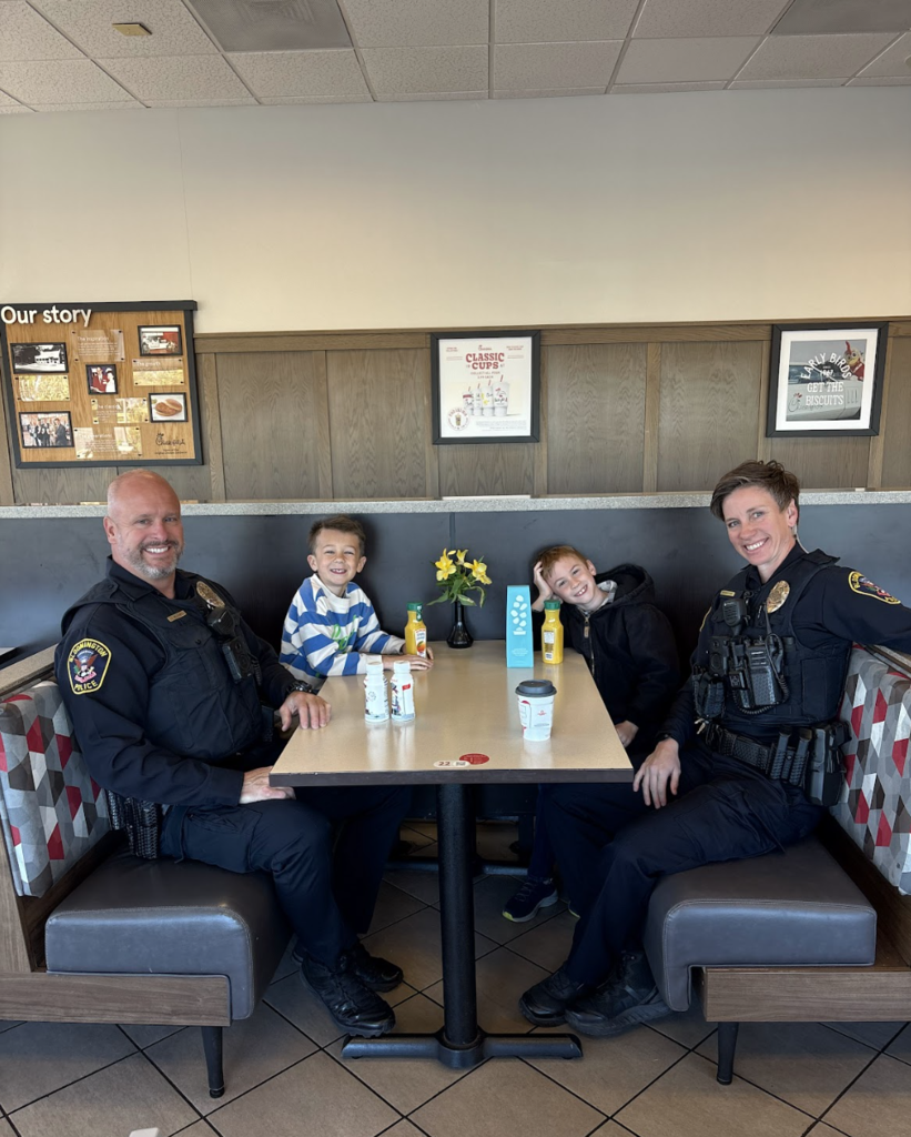 two students and two police officers at Chick-Fil-A