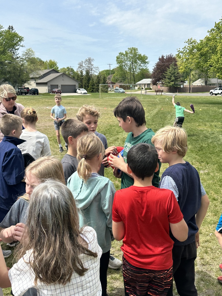 students gathered in a group talking to each other