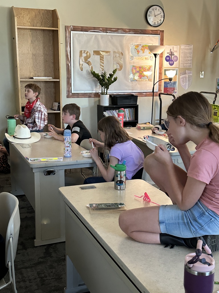 students eating ice cream and watching a movie