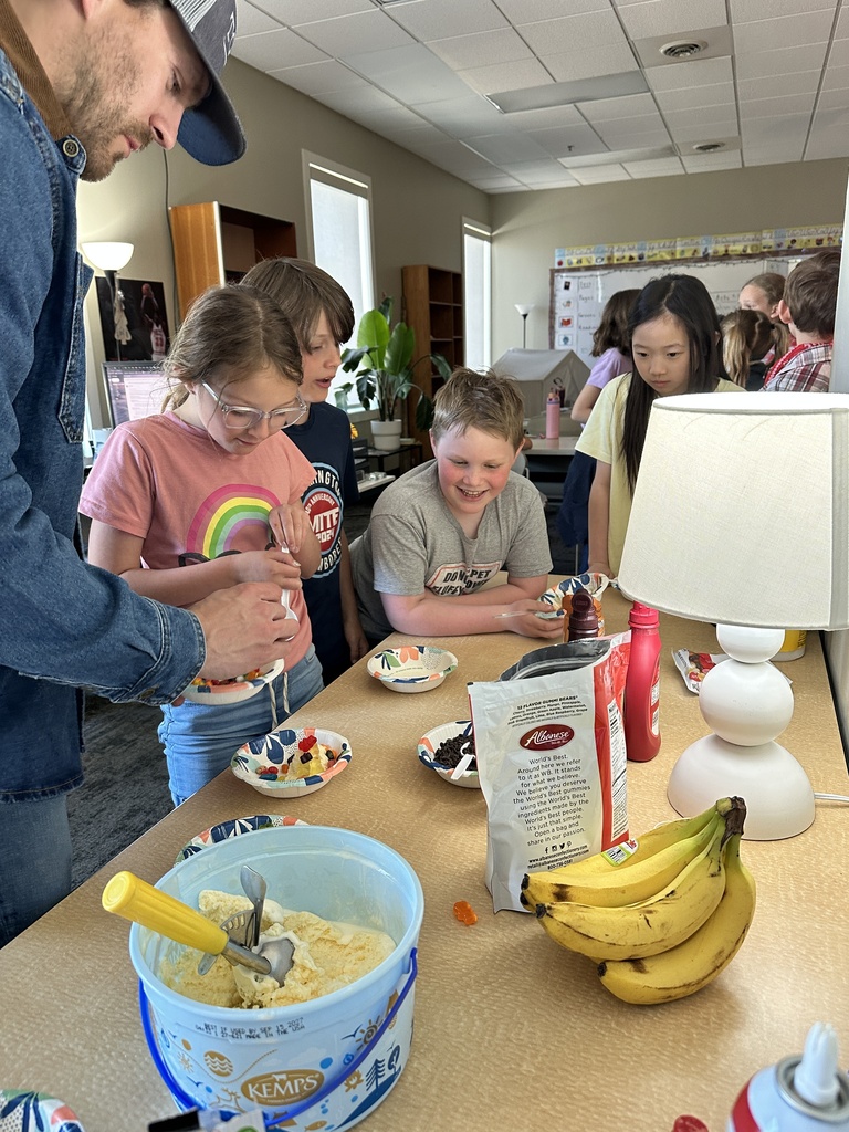 teacher scooping up ice cream for students