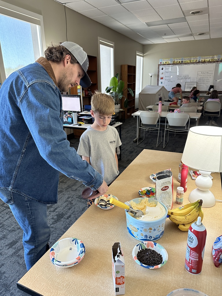 teacher scooping up ice cream for students