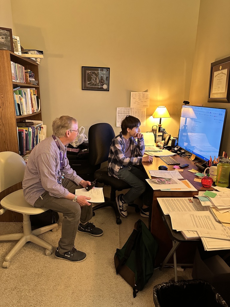 principal and "Principal for a day" looking at a computer 