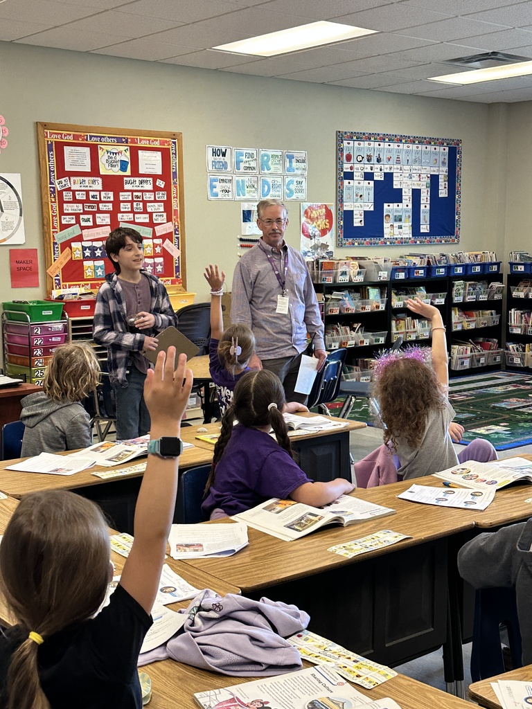 principal and "Principal for a day" visiting classrooms