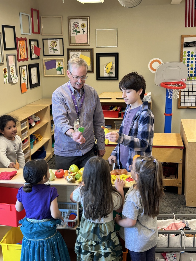 principal and "Principal for a day" visiting classrooms
