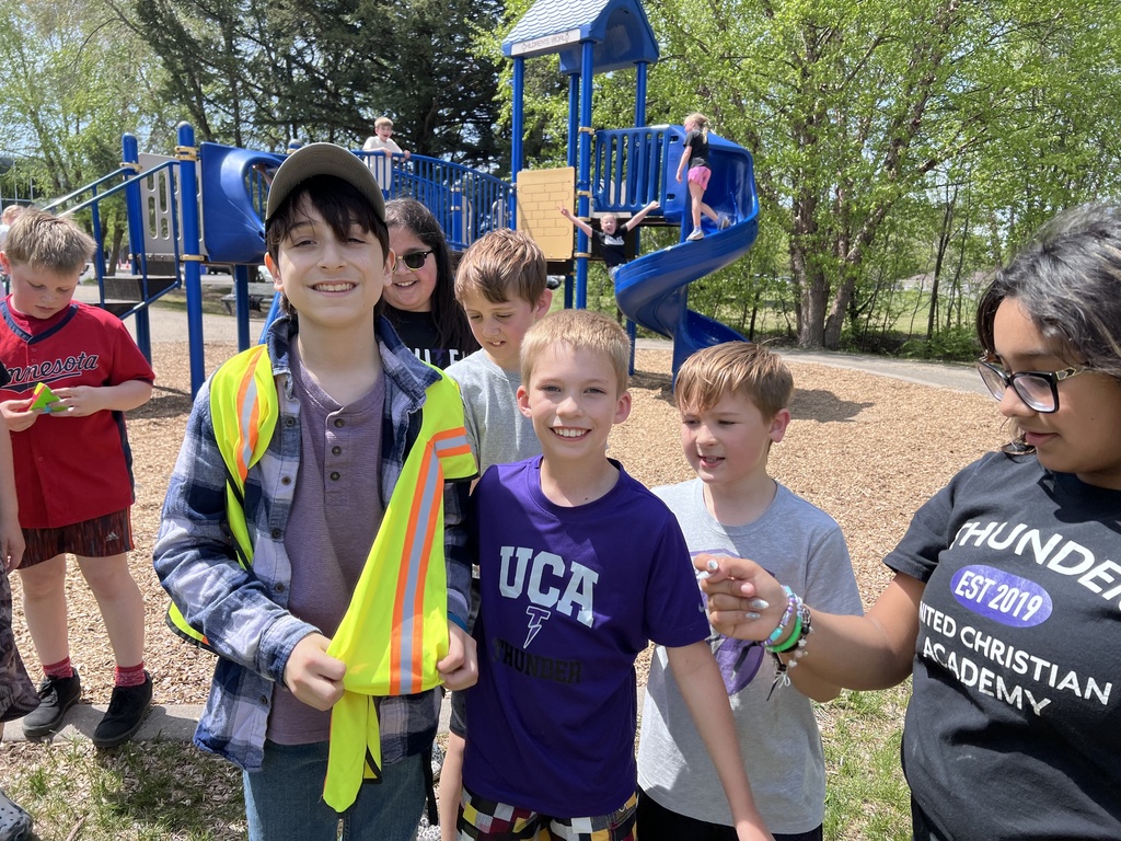 "Principal for a day" student with younger students on the playground