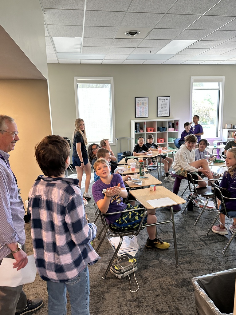 principal and "Principal for a day" visiting classrooms