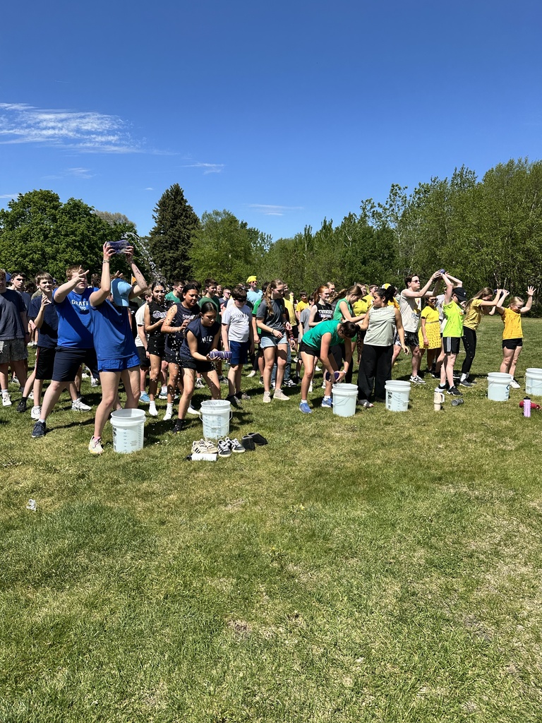 students passing wet sponges over their heads