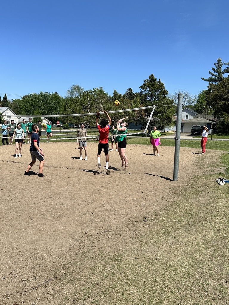 students playing beach volleyball