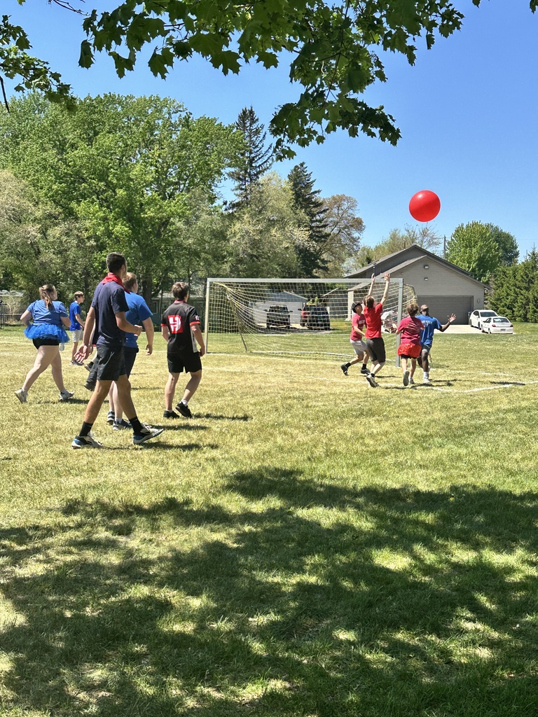 teenagers playing a game in a field