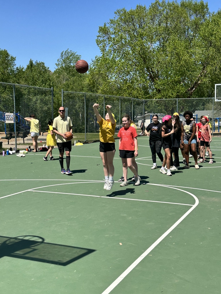 teenagers playing  basketball