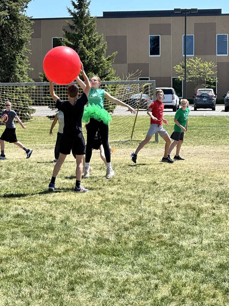 teenagers playing a game in a field